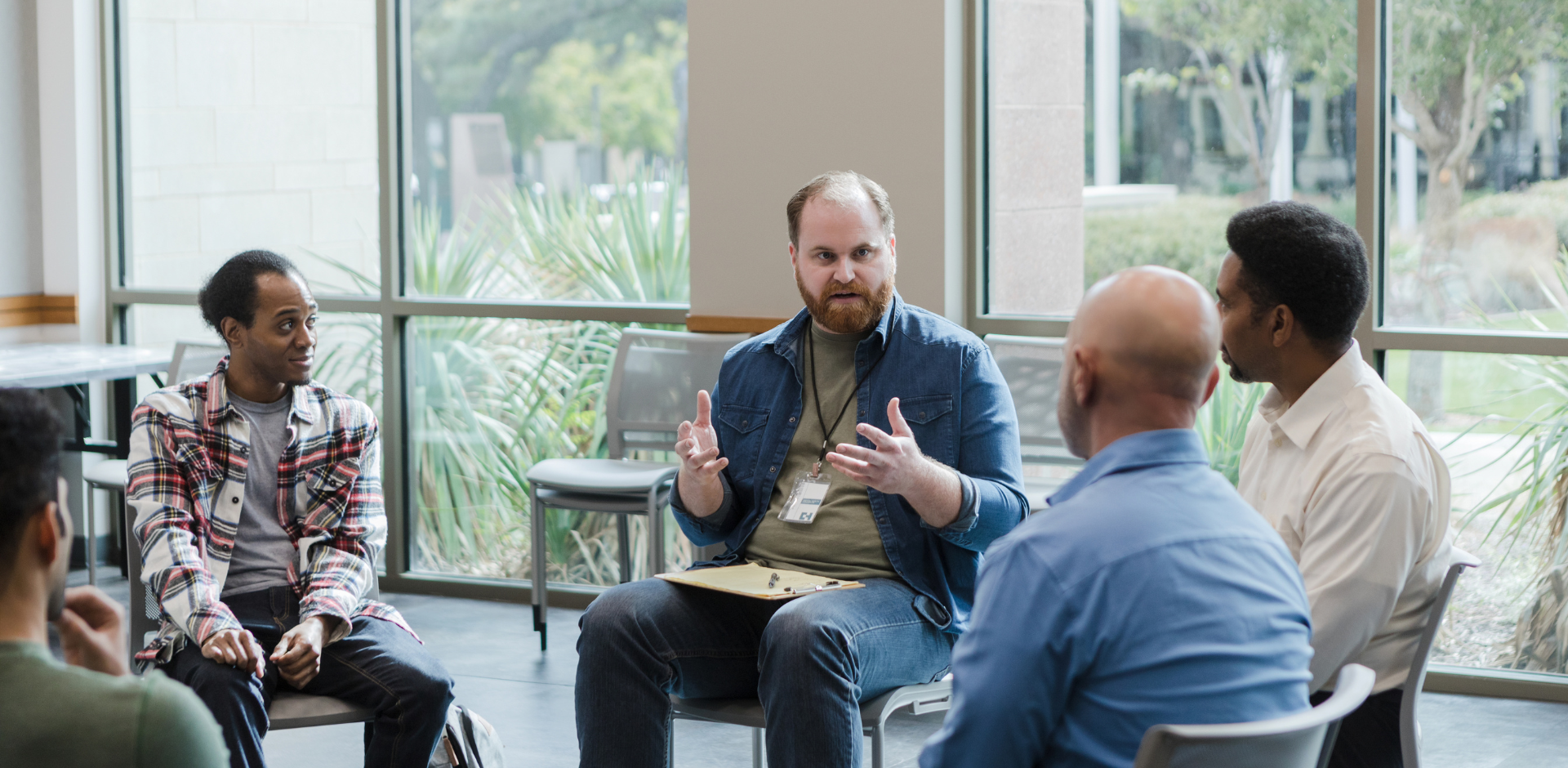 group of men talking canva stock