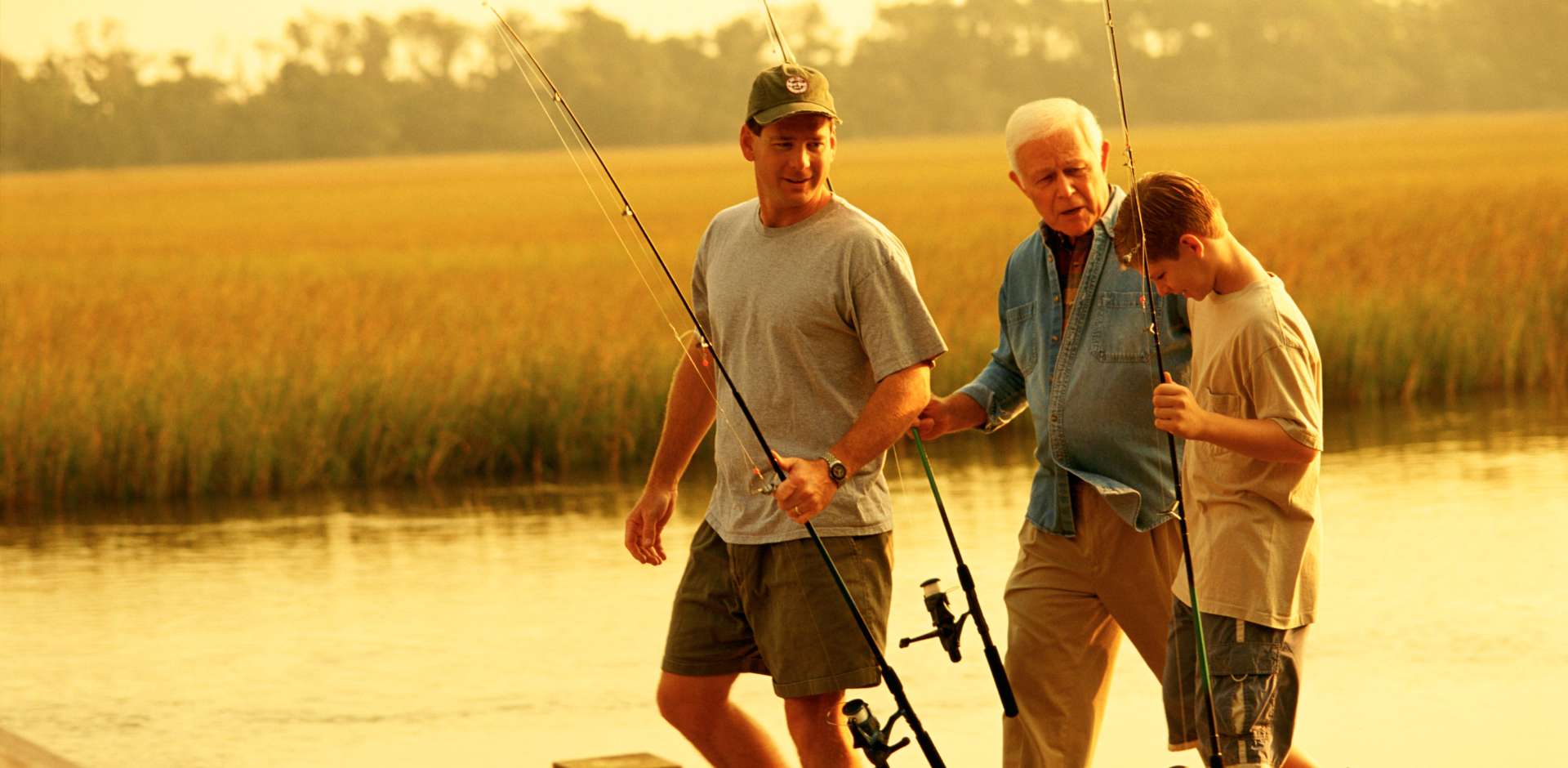 men and boy fishing canva stock