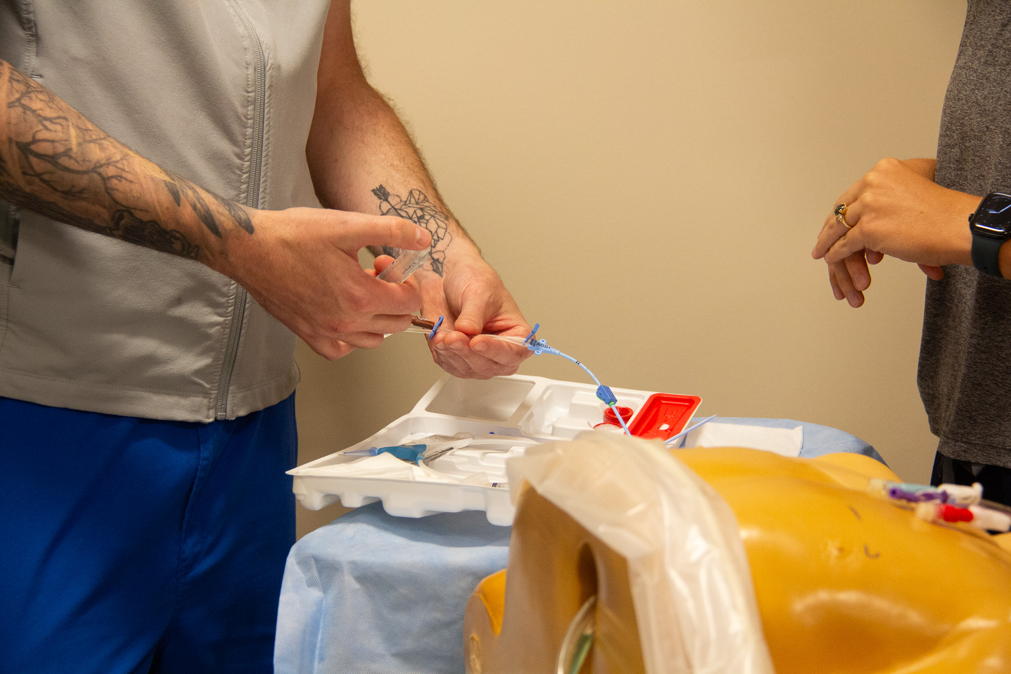 Placing a line in a teaching mannequin.