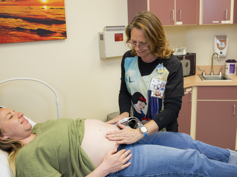 Bobi Staffler preps pregnant patient for an ultrasound.